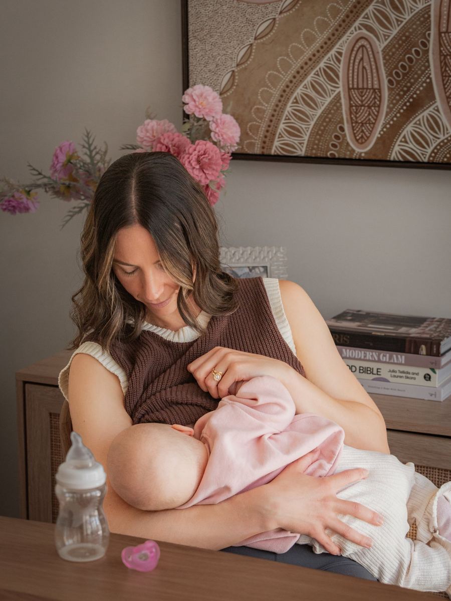 A mum breastfeeding her baby