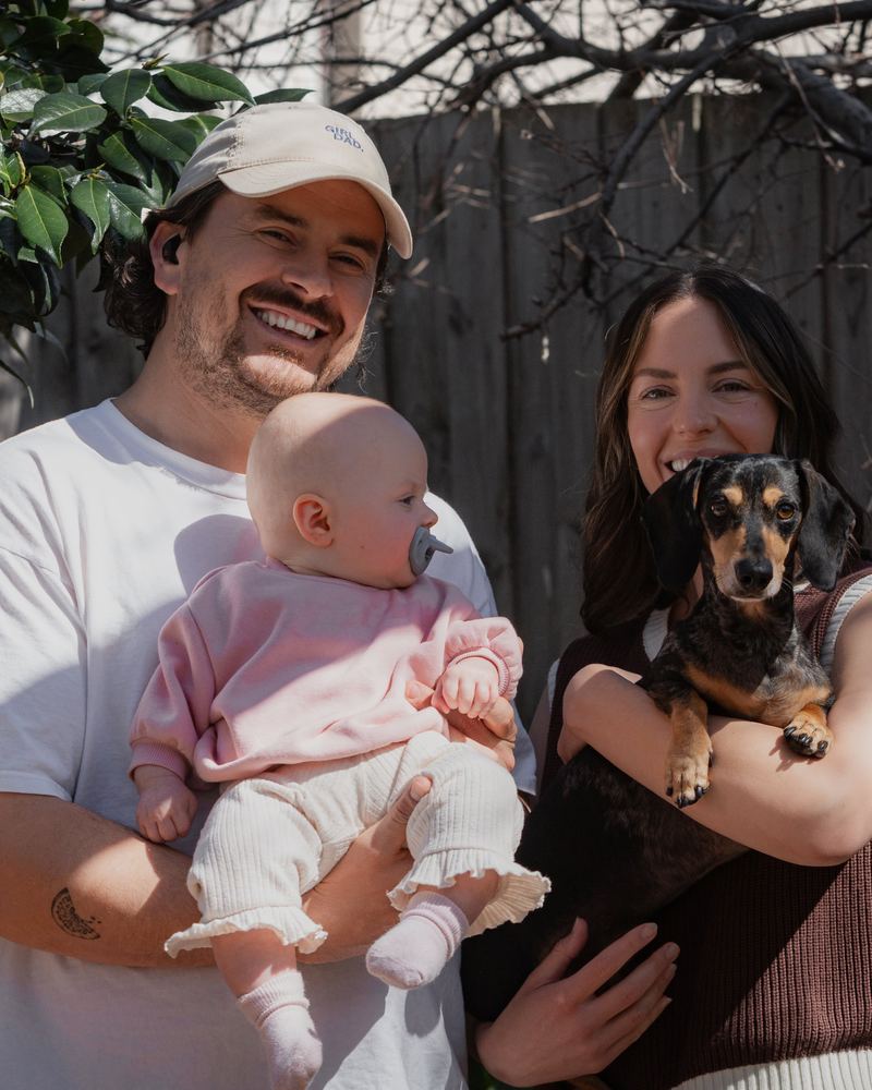 Parents with their baby, who has a Grey Minbie dummy